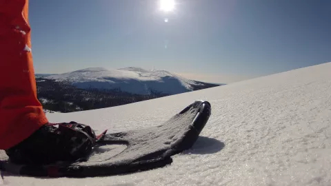 Snowboarder on the top of the mountain